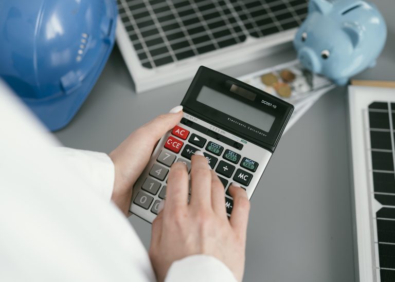 close-up-hand-holding-calculator